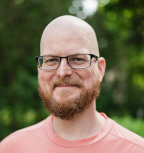 Subject: JM Janzen, middle-aged bearded caucasian man smiling, colour portrait; Credit: Liz Cooper - Kingston Photographer